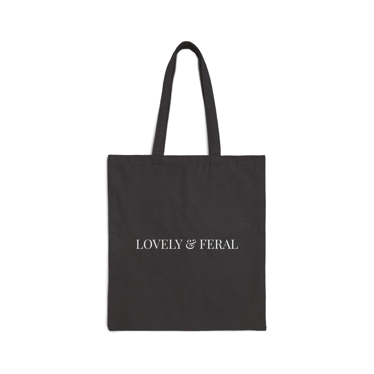 Black tote bag with 'LOVELY & FERAL' in white text shown on a white background