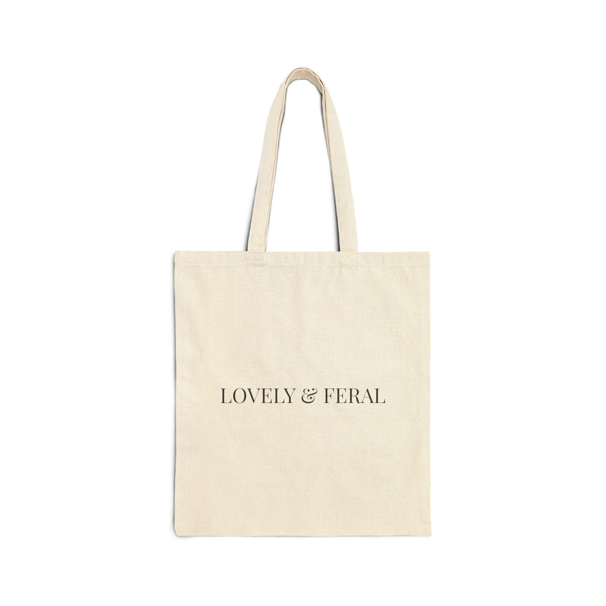 Beige tote bag with 'LOVELY & FERAL' text shown on a white background